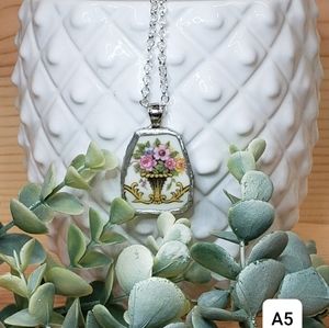 Necklace vase w/pink flowers pendant. Handmade